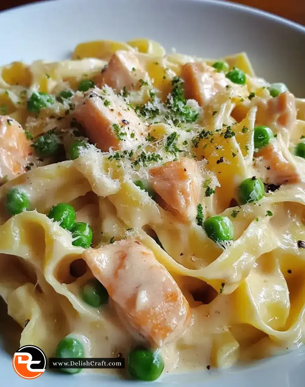 Creamy salmon tagliatelle with peas in a white sauce