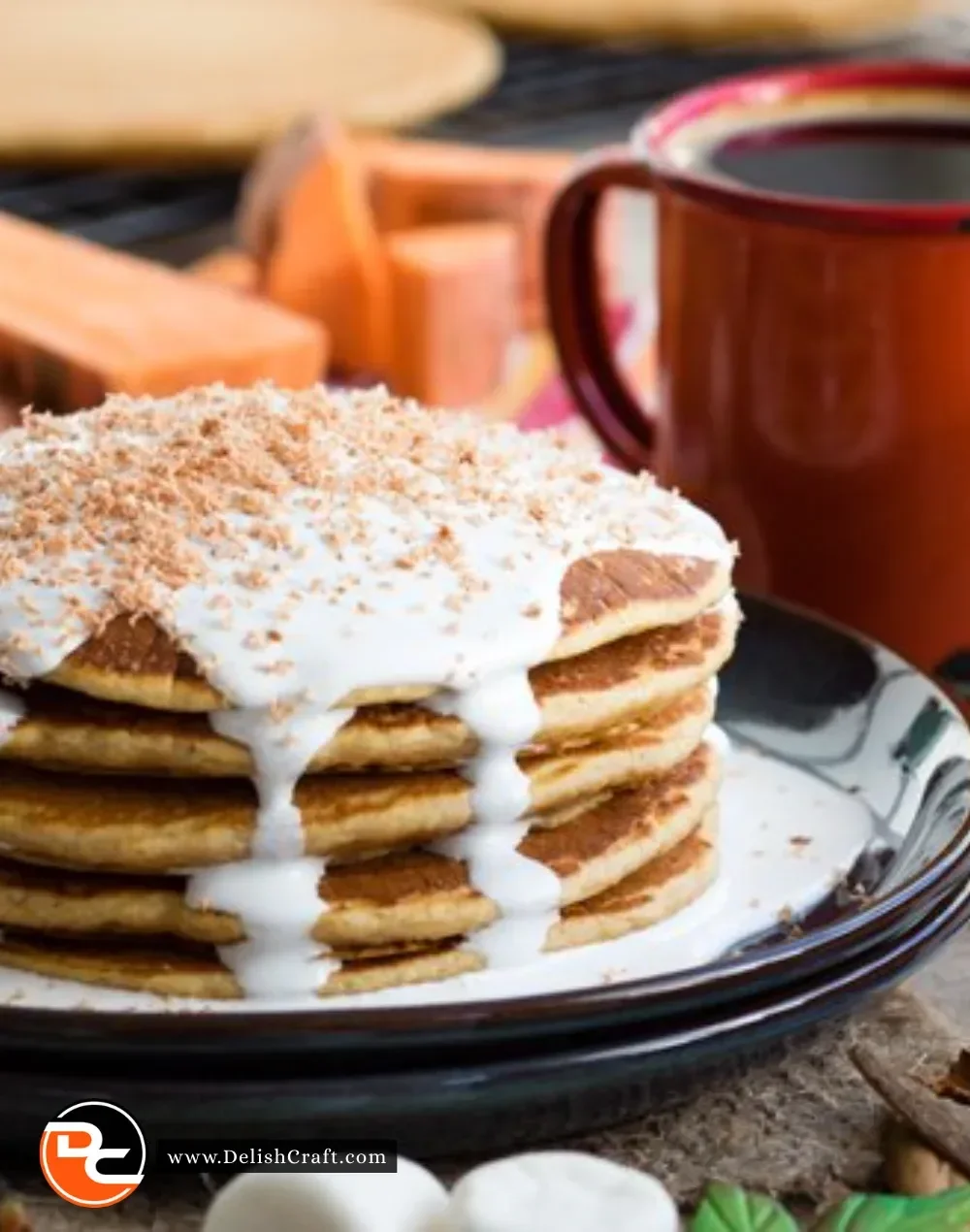Stack of easy sweet potato pancakes topped with syrup and berries
