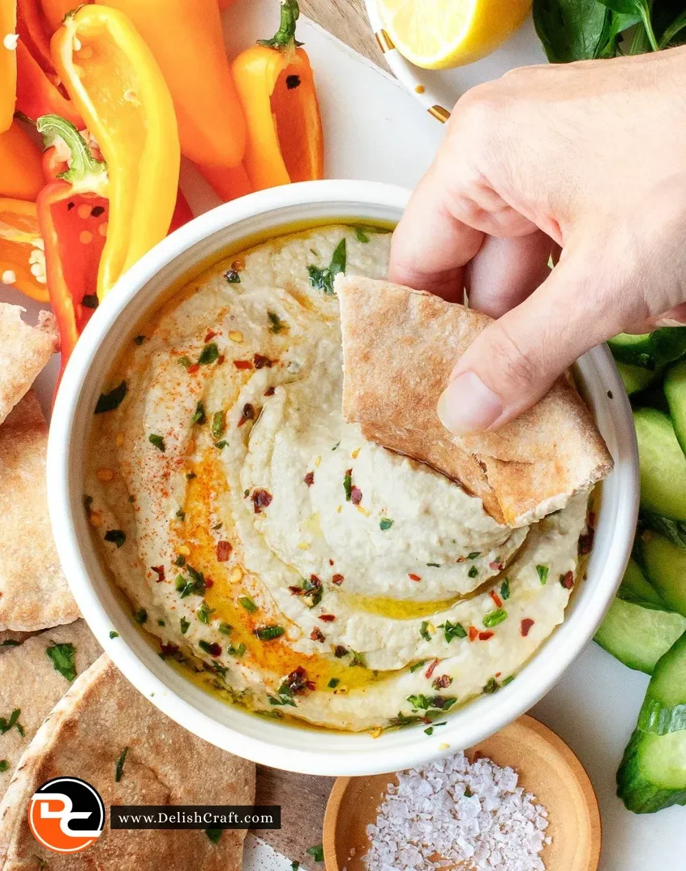 Delicious homemade eggplant dip served with crackers and vegetables.