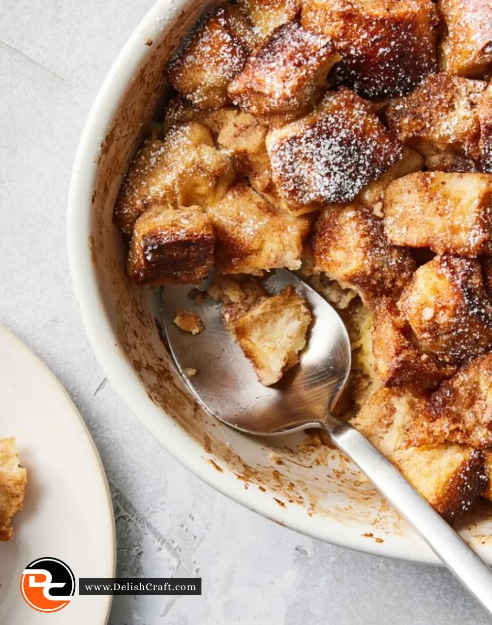 Delicious French toast casserole served with syrup and berries on a plate