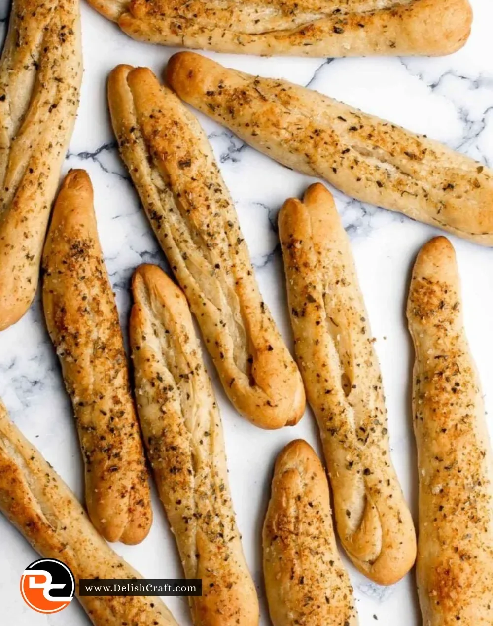 Freshly baked garlic breadsticks served with dipping sauce