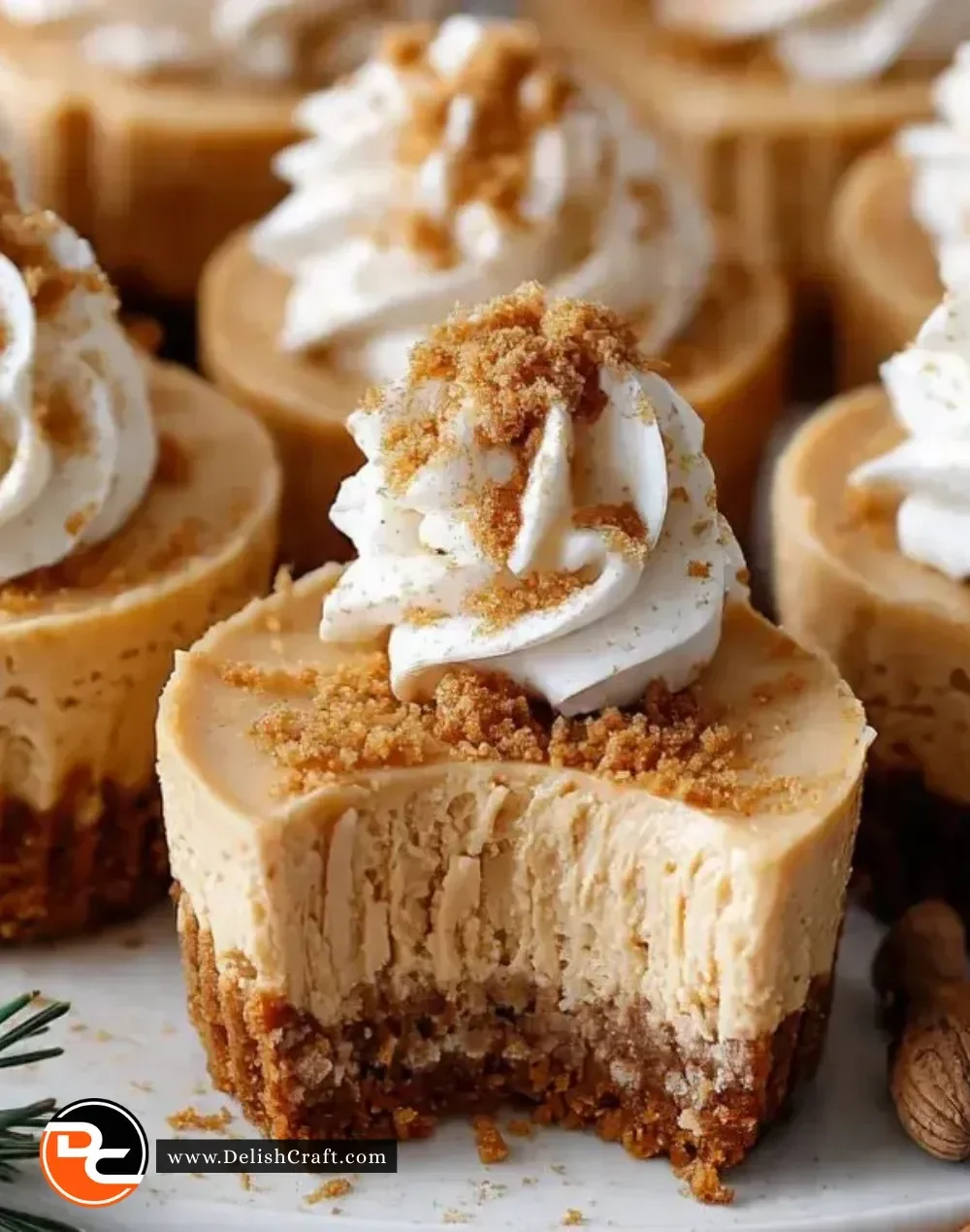 Delicious Gingerbread Cheesecake Cups topped with whipped cream and spices