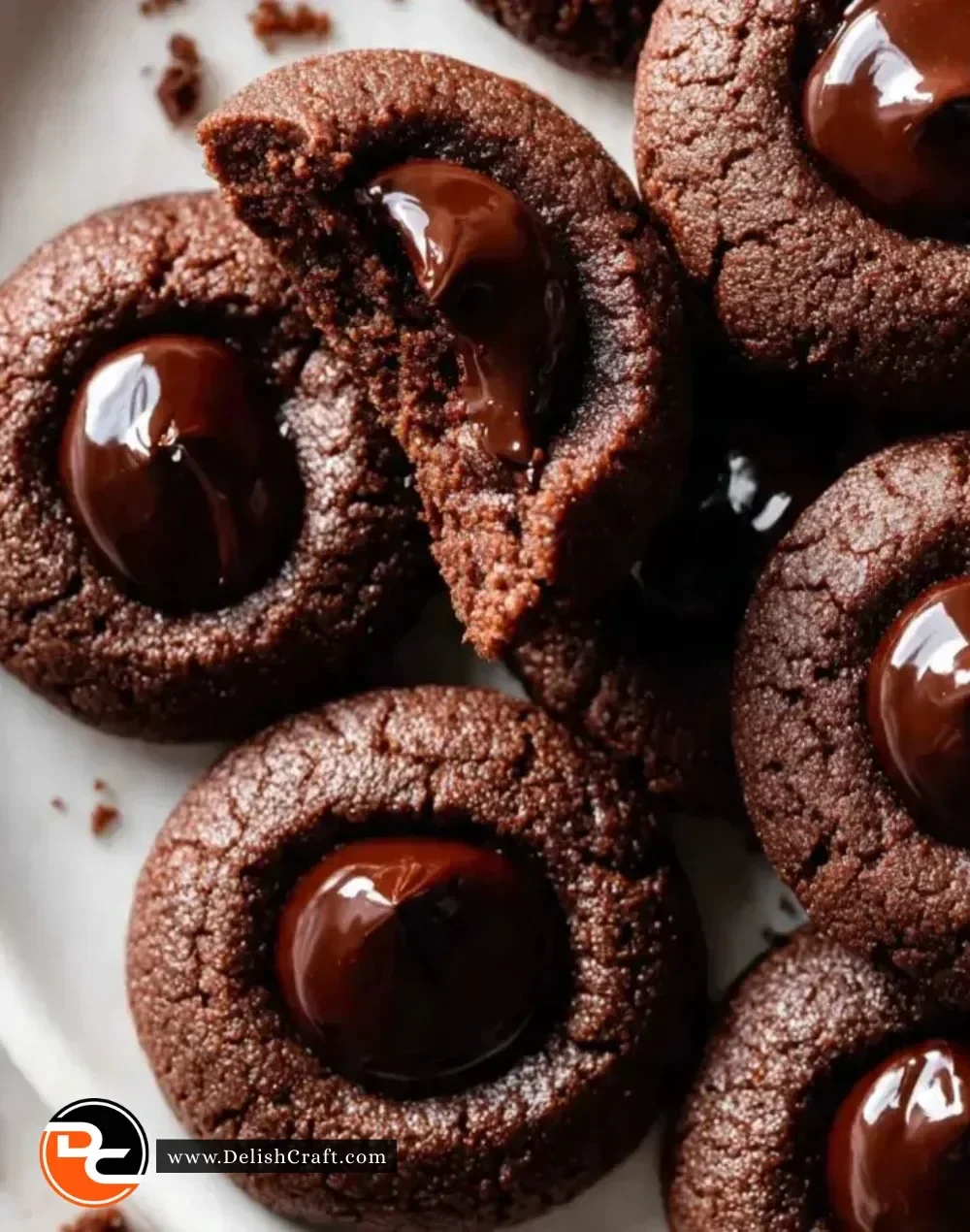 Plate of gluten-free chocolate thumbprint Christmas cookies decorated with festive sprinkles