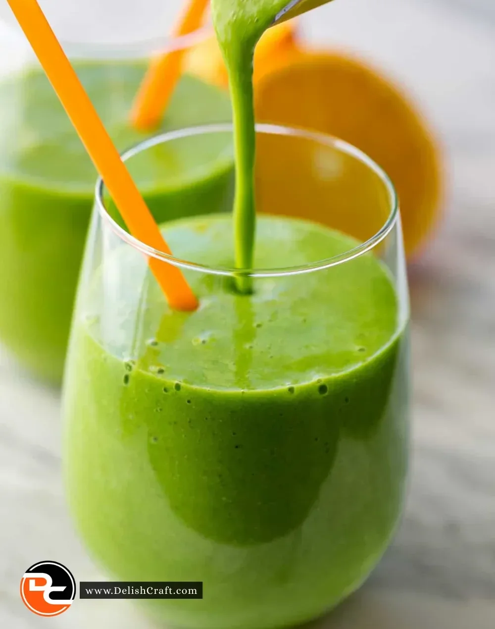 A vibrant green smoothie made with spinach, bananas, and almond milk in a glass