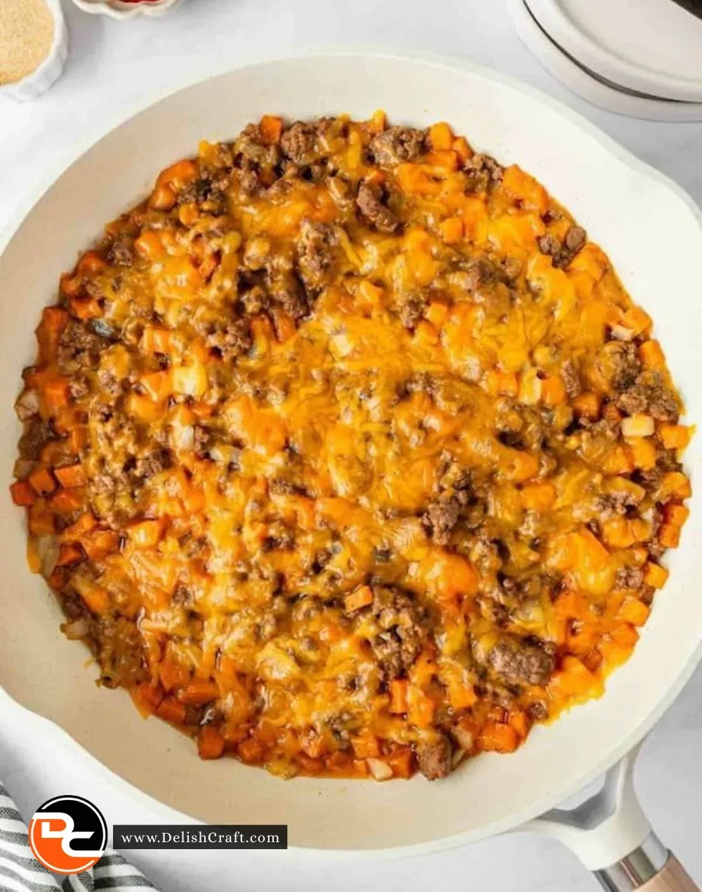 Cooked ground beef and sweet potatoes served in a bowl, showcasing a nutritious meal.