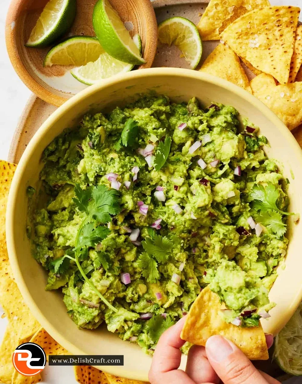 Delicious homemade guacamole served in a bowl with tortilla chips