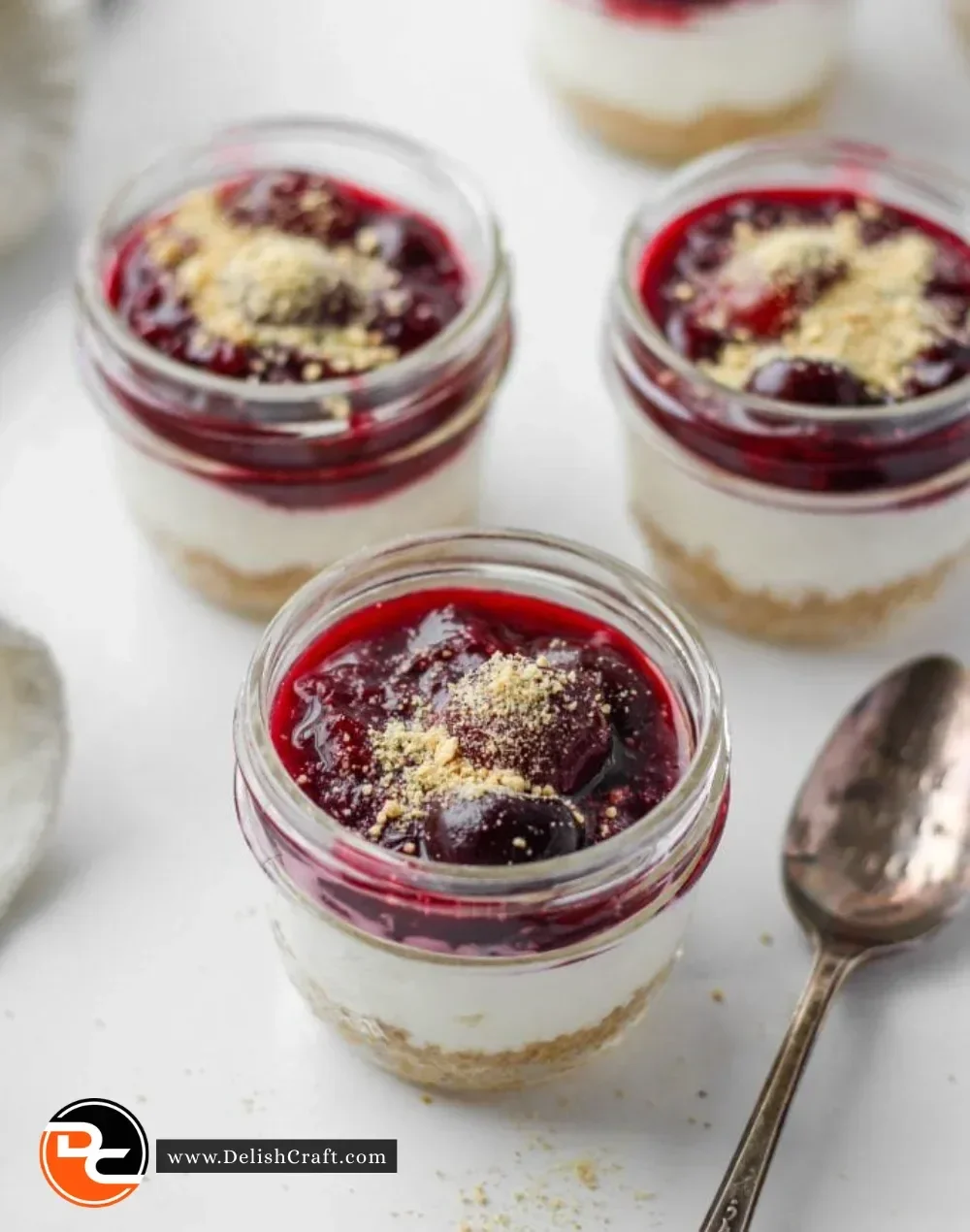 Healthier no-bake cheesecake in a jar with fresh fruit topping