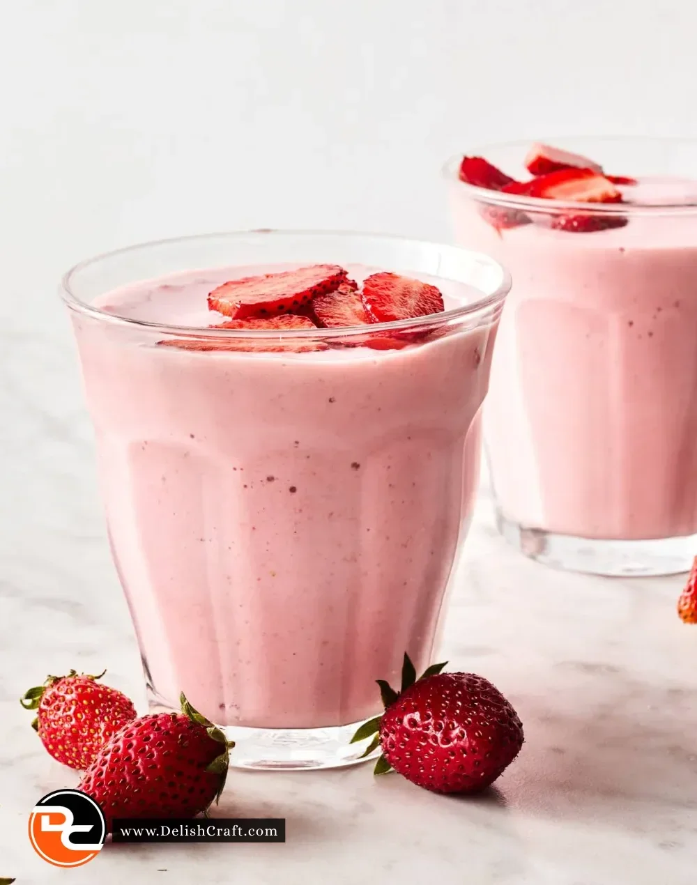 Colorful and nutritious healthy breakfast smoothies in glasses with fresh fruits.