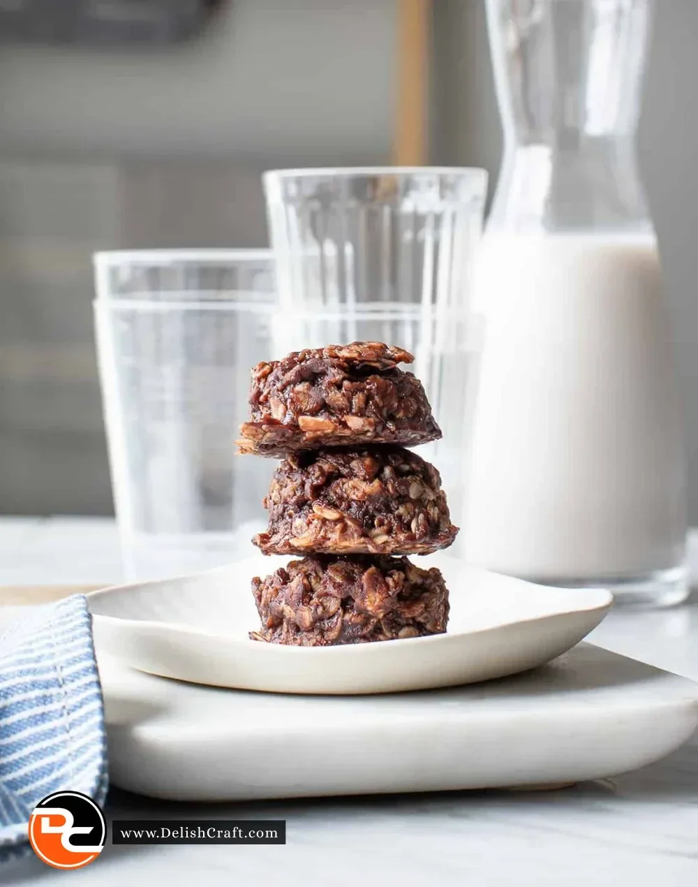 A plate of healthy no bake cookies made with oats, nut butter, and chocolate.