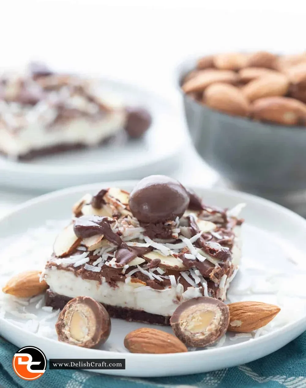 Keto Almond Joy Cheesecake Bars with chocolate and almond toppings