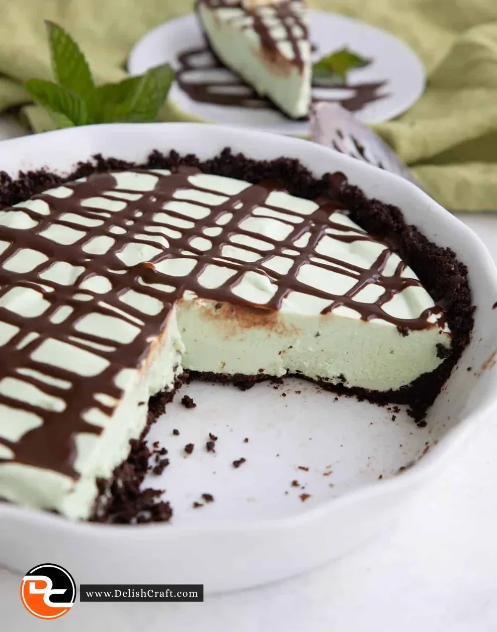 A slice of Keto Grasshopper Pie topped with whipped cream on a plate