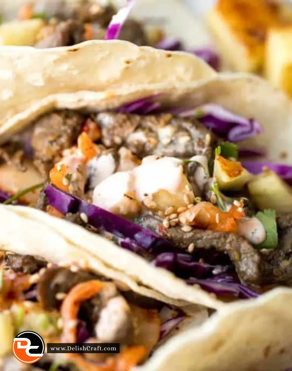 Delicious Korean beef steak tacos topped with vibrant vegetables and sauces.