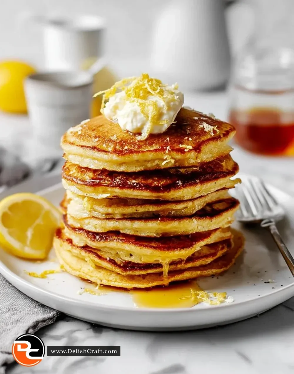 Lemon ricotta protein pancakes stacked with fresh berries and syrup
