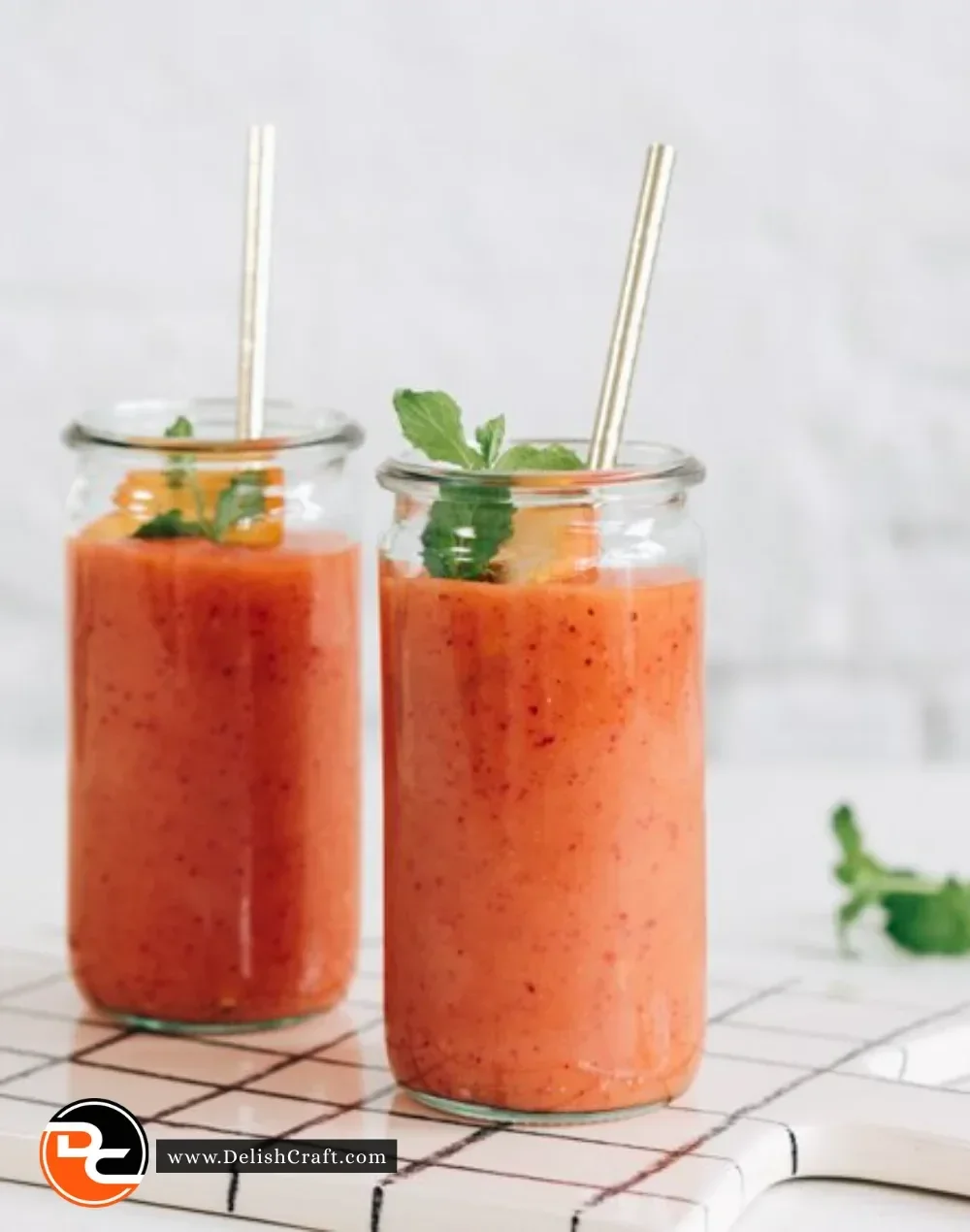 Delicious Mango Strawberry Peach Smoothie in a glass with fresh fruits