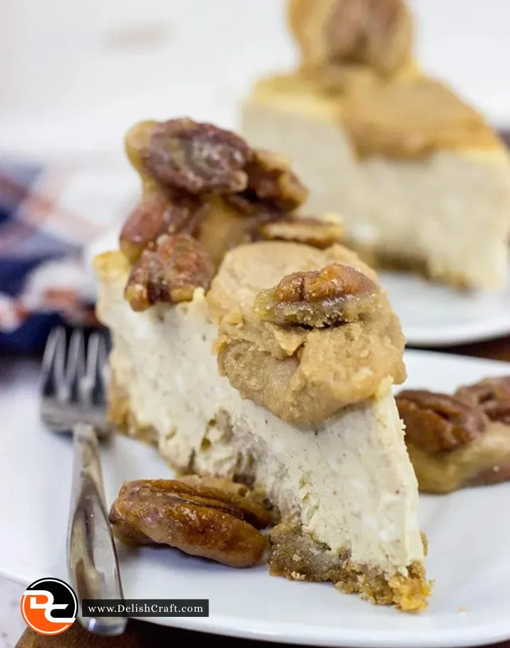 Maple Pecan Praline Cheesecake topped with caramelized pecans and maple drizzle