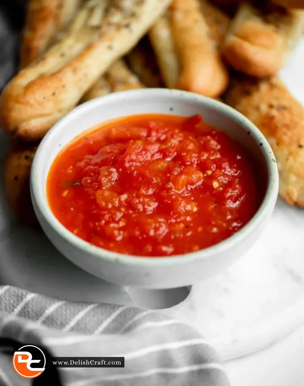 Homemade marinara sauce in a bowl, ready to enhance your favorite pasta dishes.