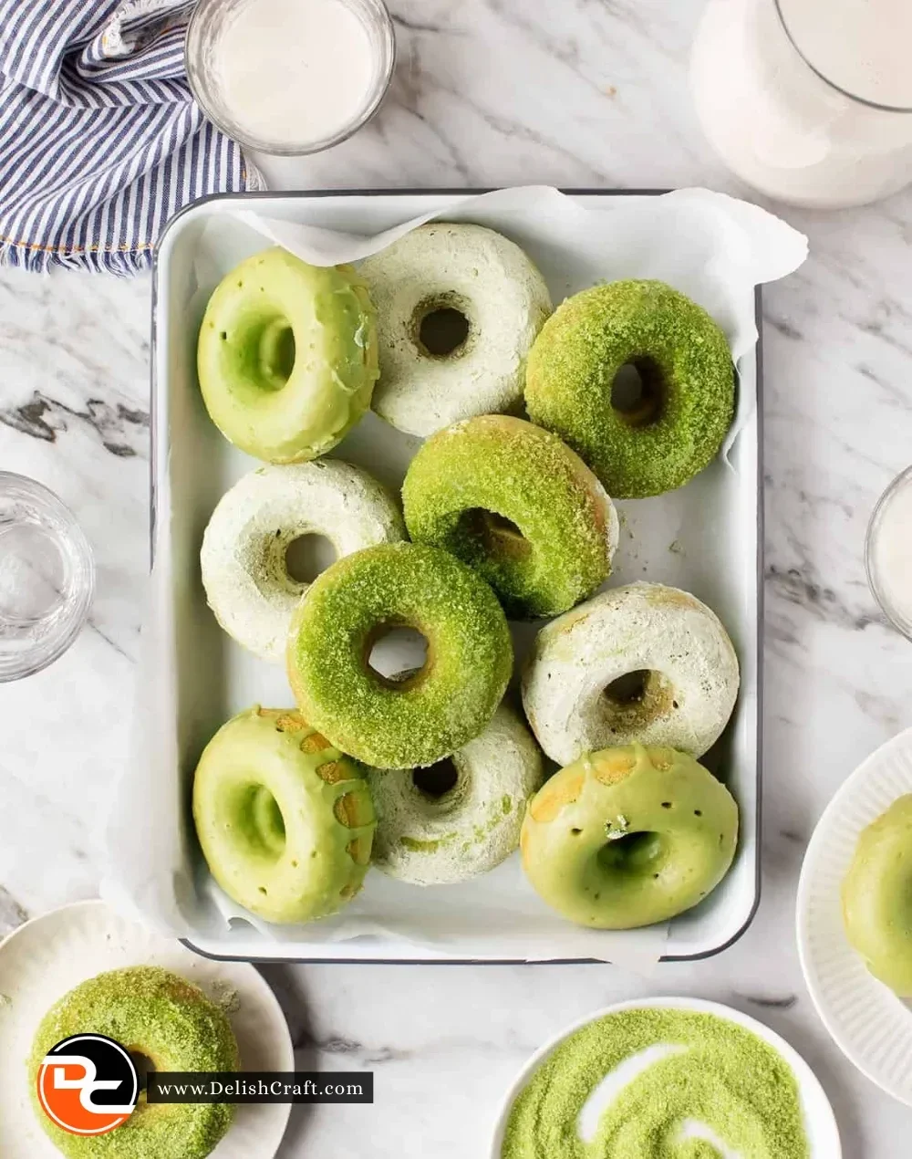 Freshly baked matcha doughnuts on a cooling rack