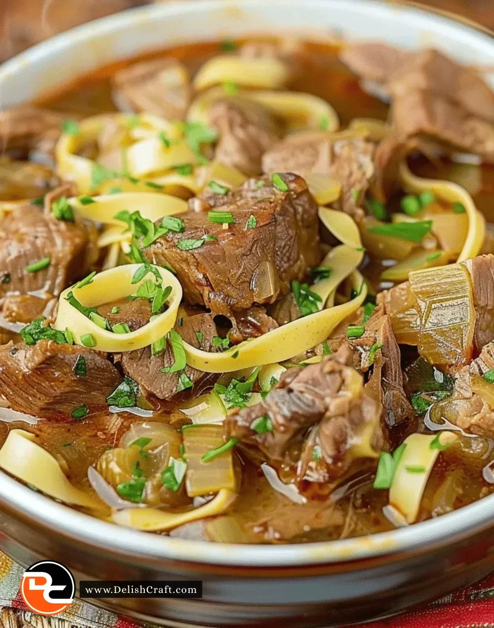 Bowl of Mississippi Pot Roast Soup with vegetables and herbs