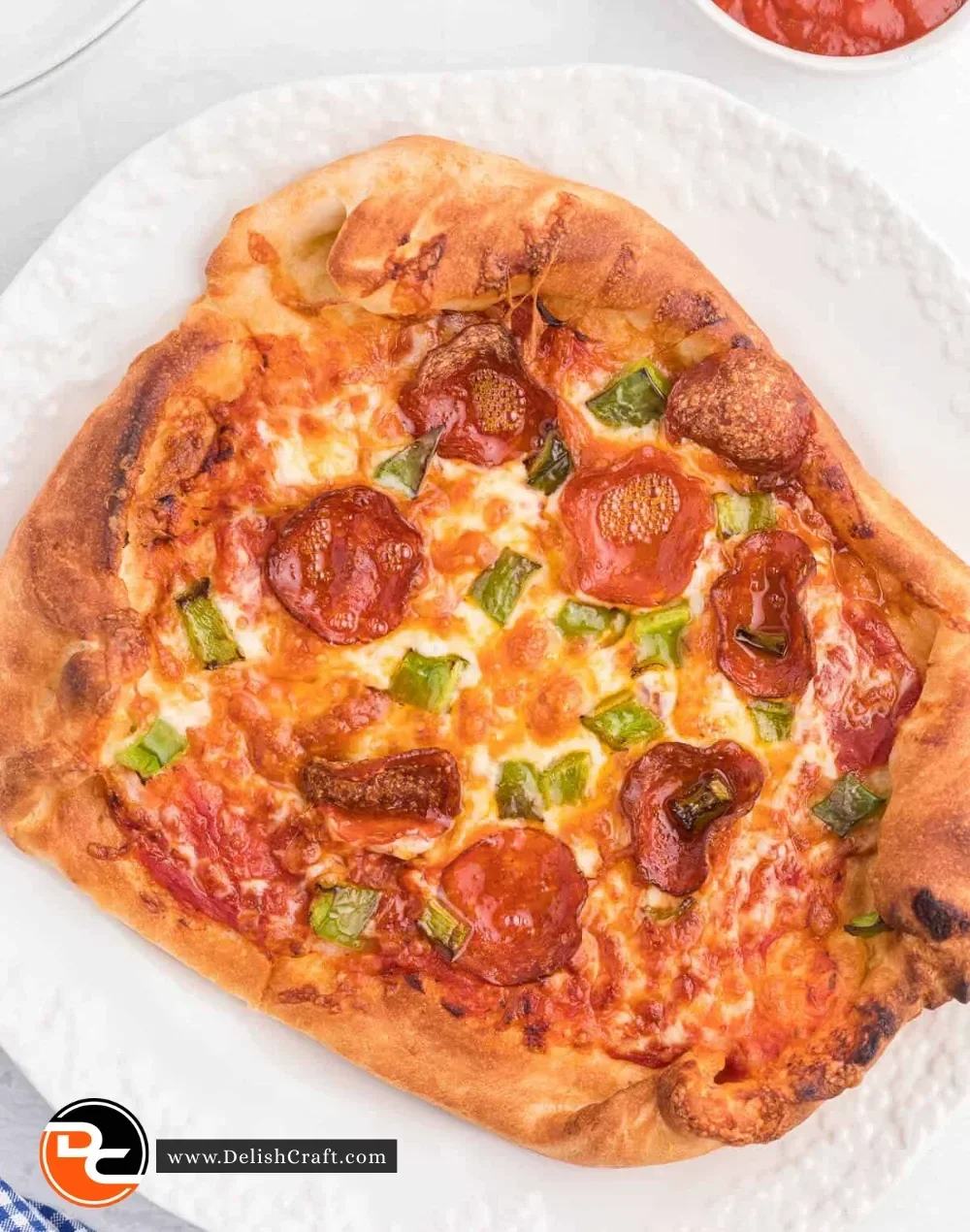 Ninja Air Fryer pizza cooking with crispy toppings