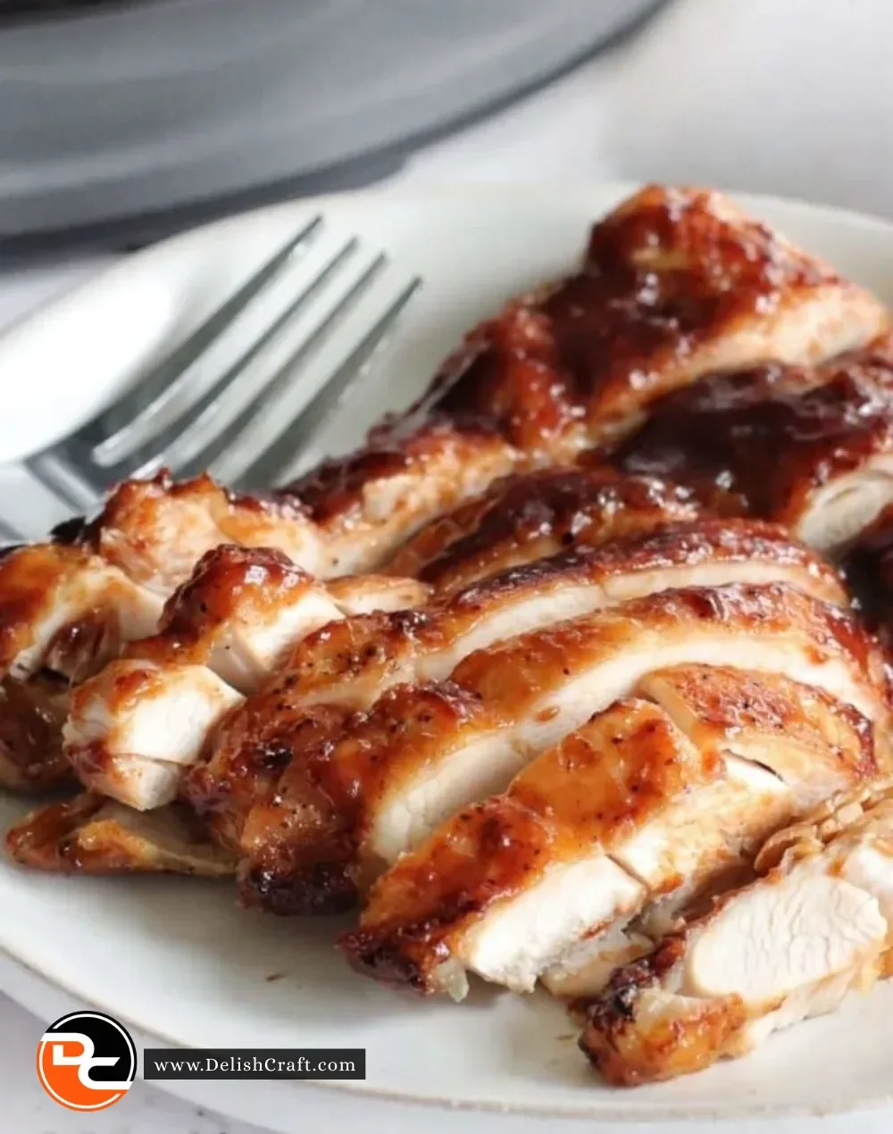 Deliciously cooked Ninja Foodi chicken thighs served on a plate.