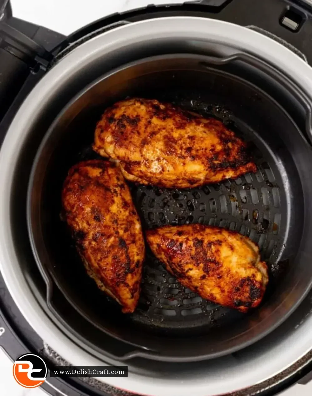 Ninja Foodi cooking frozen chicken breast for a quick and easy meal