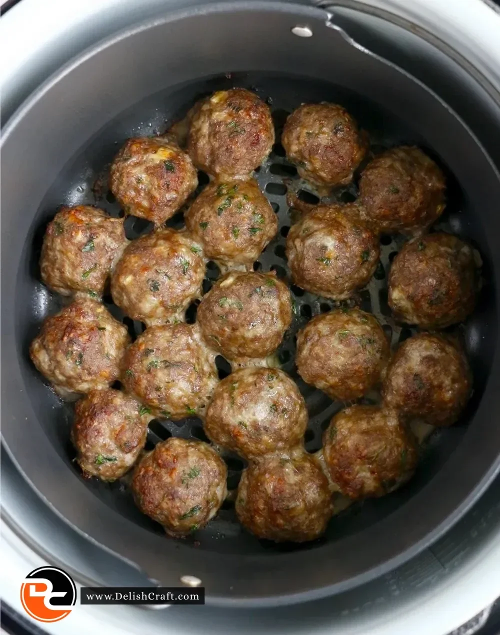 Ninja Foodi homemade meatballs with fresh herbs and spices on a plate
