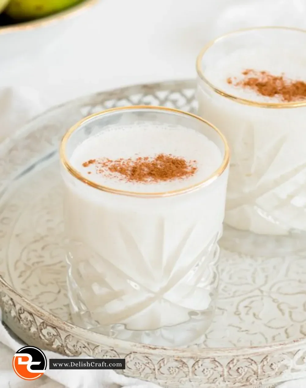 Delicious Oat Pear Smoothie in a glass with fresh pear slices and oats
