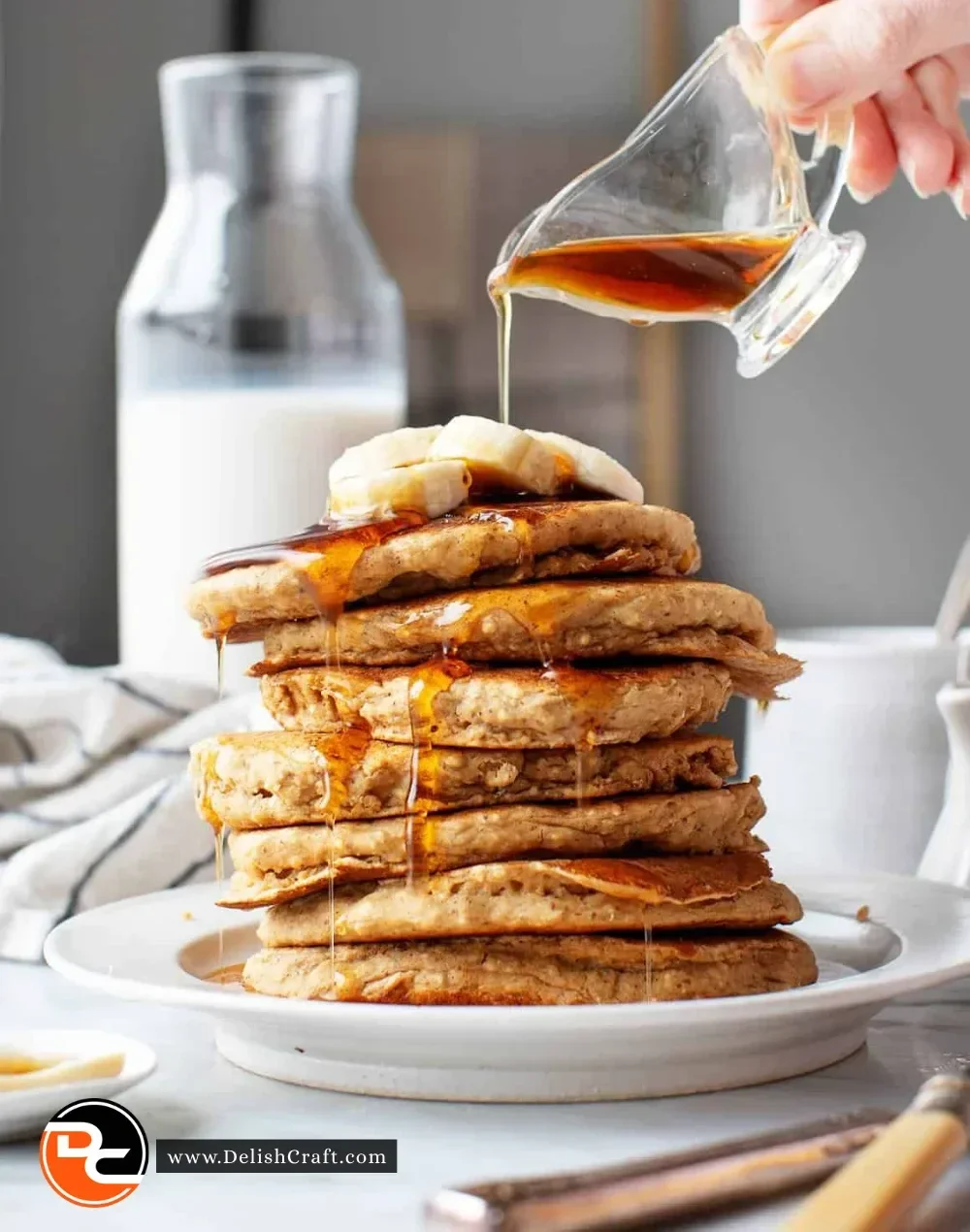 Delicious pancake waffle breakfast served with syrup and fruit
