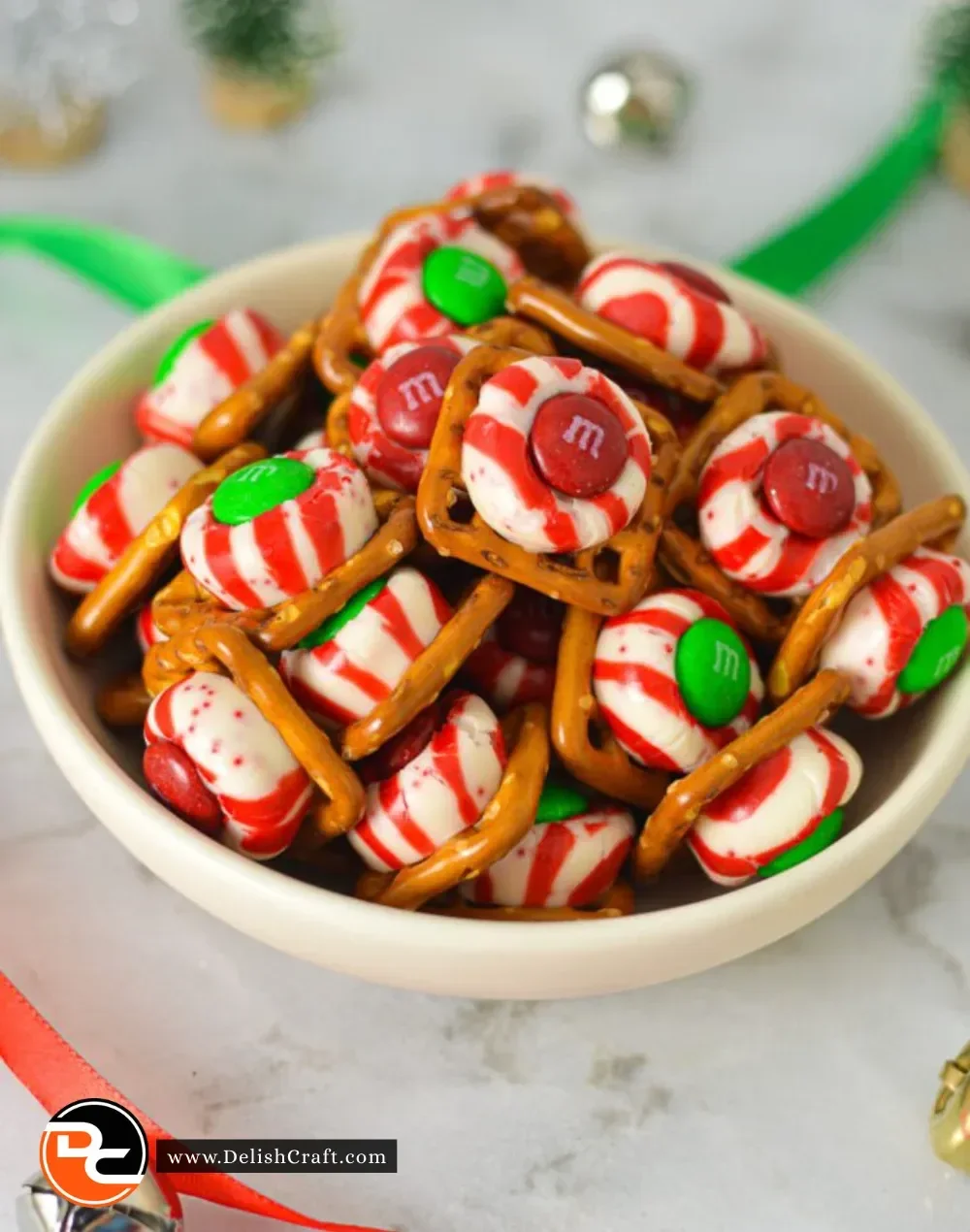Delicious Peppermint Kiss Pretzels topped with chocolate and crushed candy canes