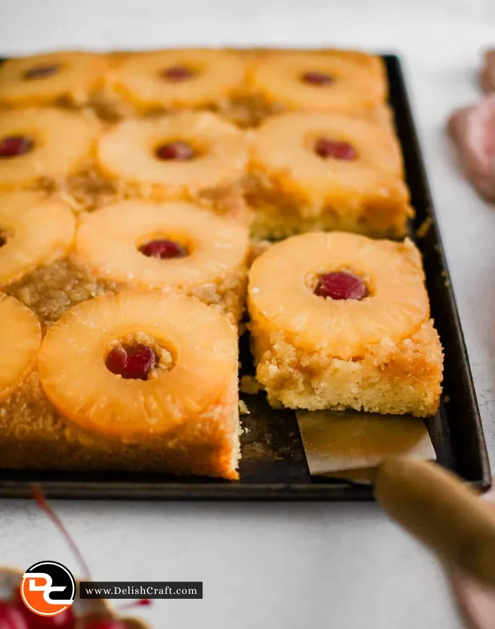 Delicious slice of Pineapple Upside Down Cake with caramelized pineapple on top