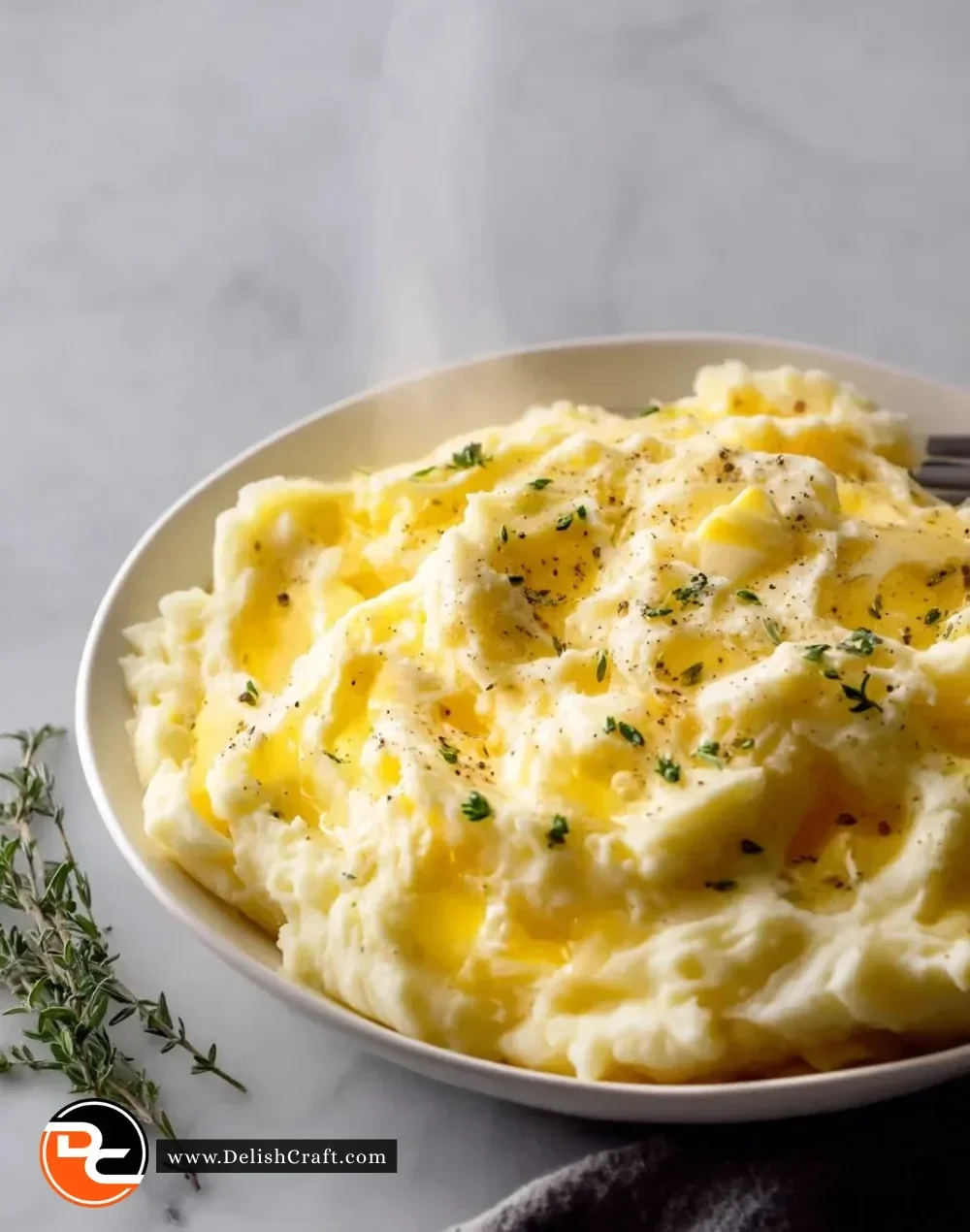 Bowl of creamy Gouda mashed potatoes with butter and herbs