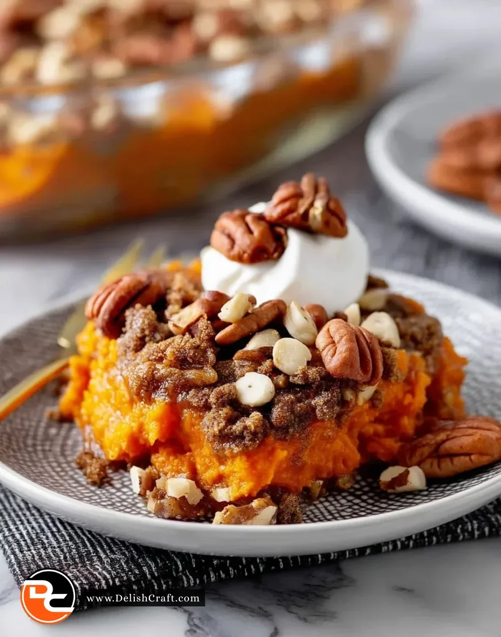 Delicious Southern sweet potato casserole topped with marshmallows and pecans.