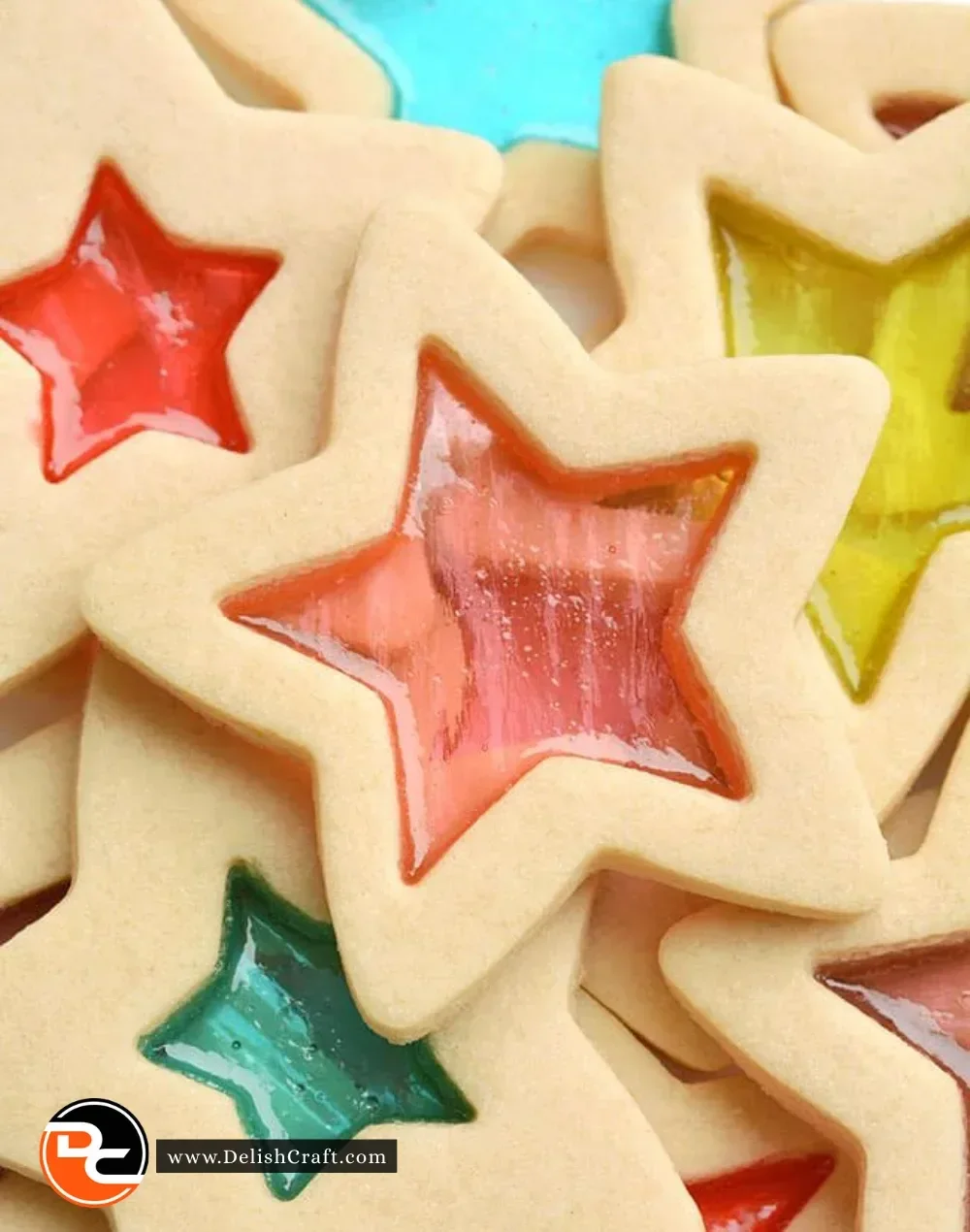 Plate of vibrant stained glass cookies showcasing bright colors and festive shapes.