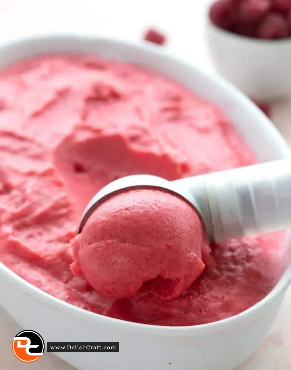 Sugar Free Keto Raspberry Sorbet in a bowl with fresh raspberries