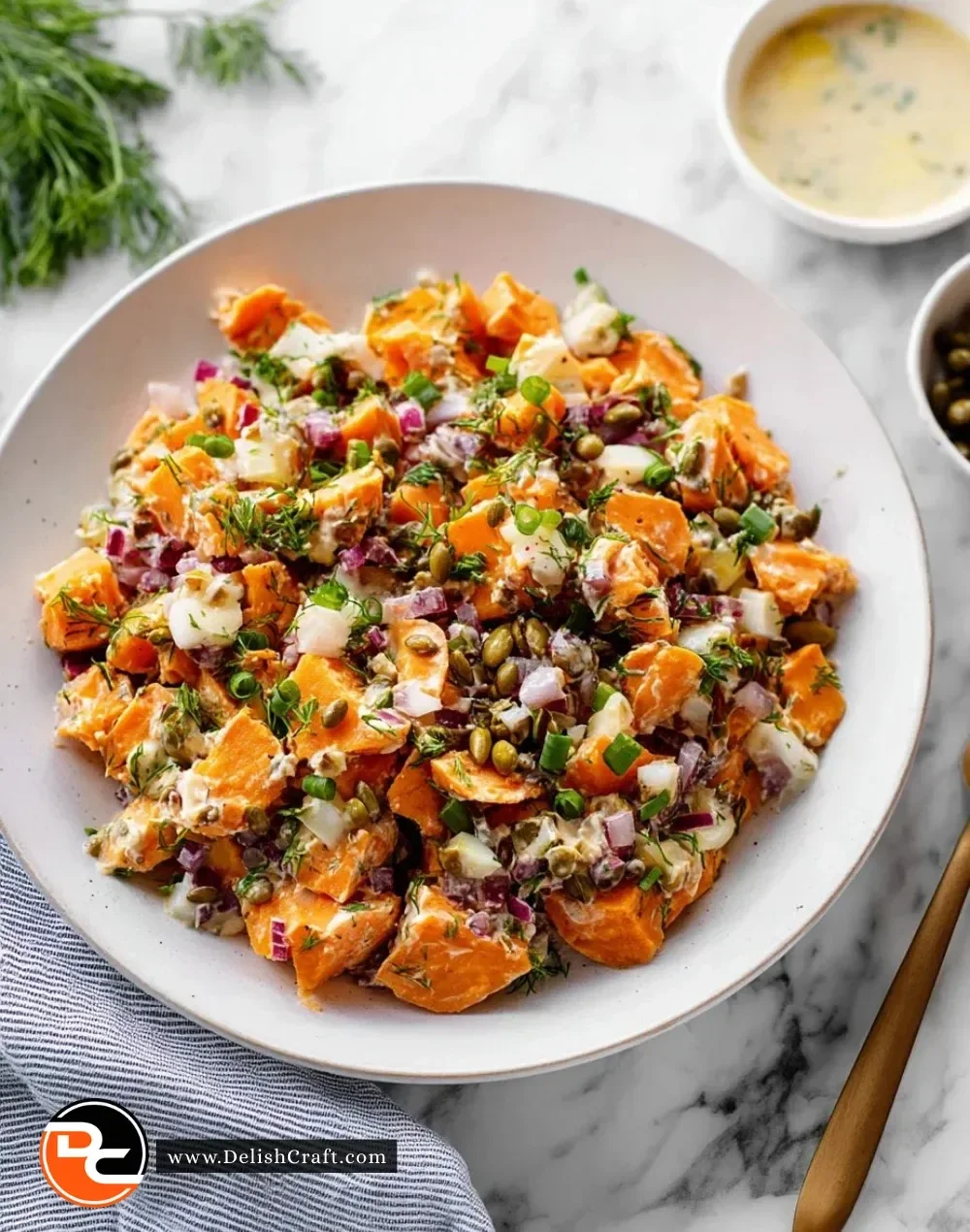 Colorful sweet potato salad with vegetables and dressing in a bowl