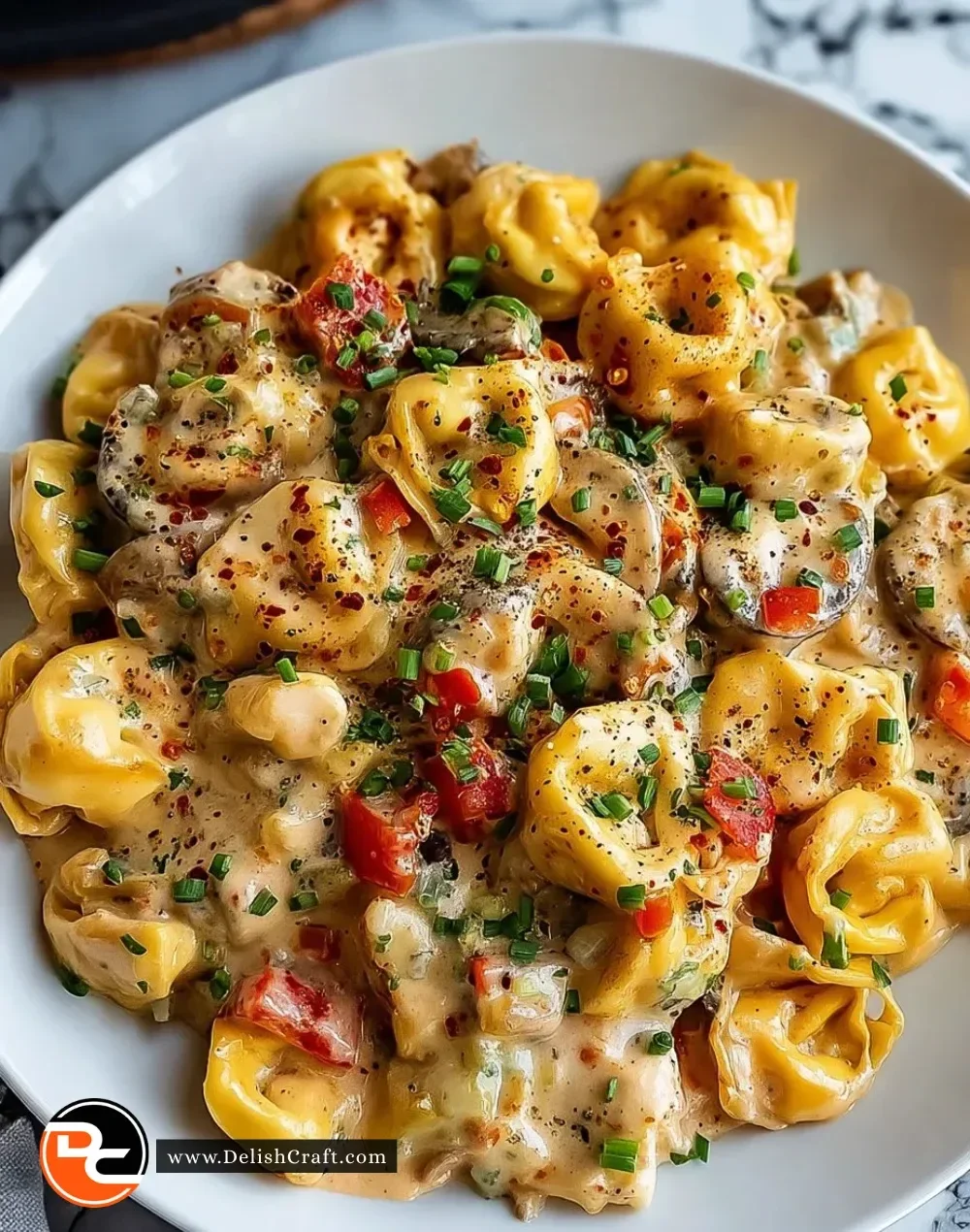 Loaded Cajun Alfredo Tortellini skillet with shrimp and vegetables
