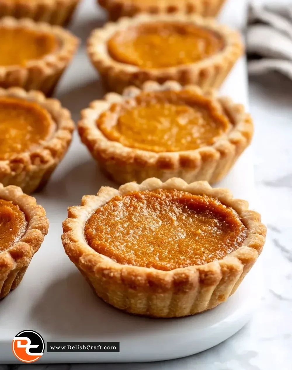 Traditional mini sweet potato pies with a flaky crust and rich filling
