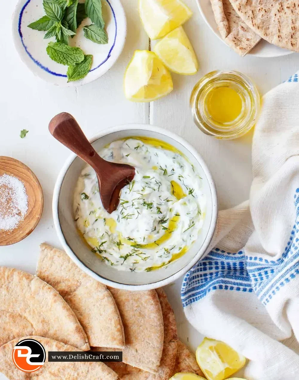 Homemade Tzatziki sauce with cucumber and yogurt served with pita bread.
