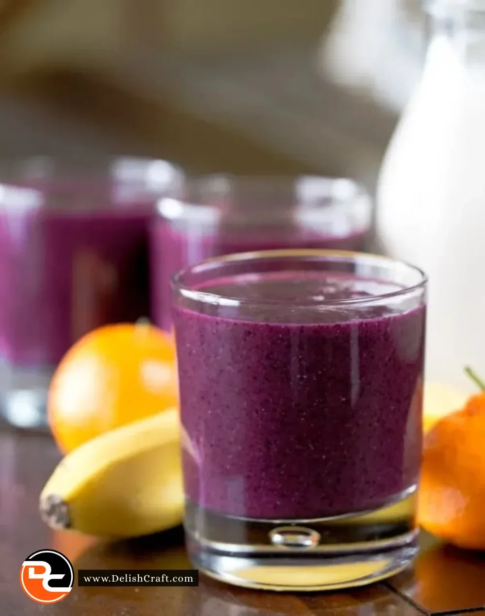 A creamy velvety blueberry smoothie topped with fresh blueberries.