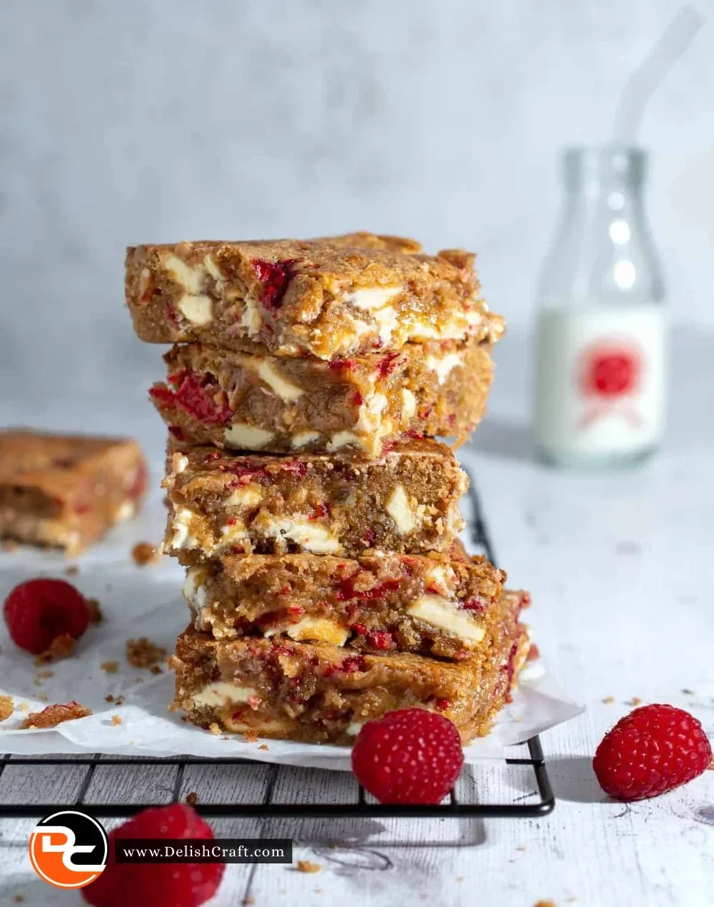 Delicious white chocolate and raspberry blondies on a plate, perfect for dessert
