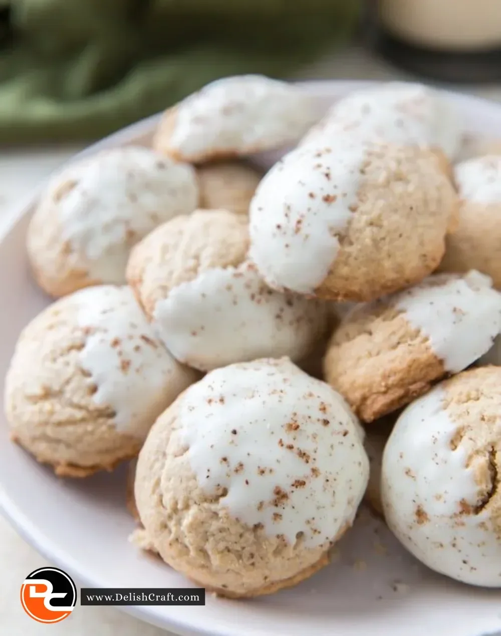 Delicious white chocolate dipped eggnog cookies adorned with festive decorations.