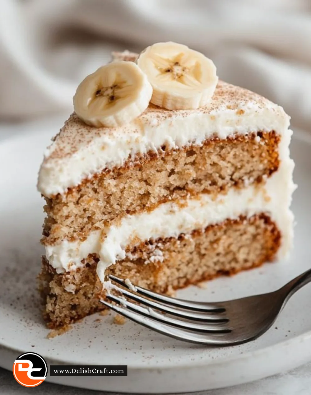 Delicious homemade banana cake topped with creamy frosting