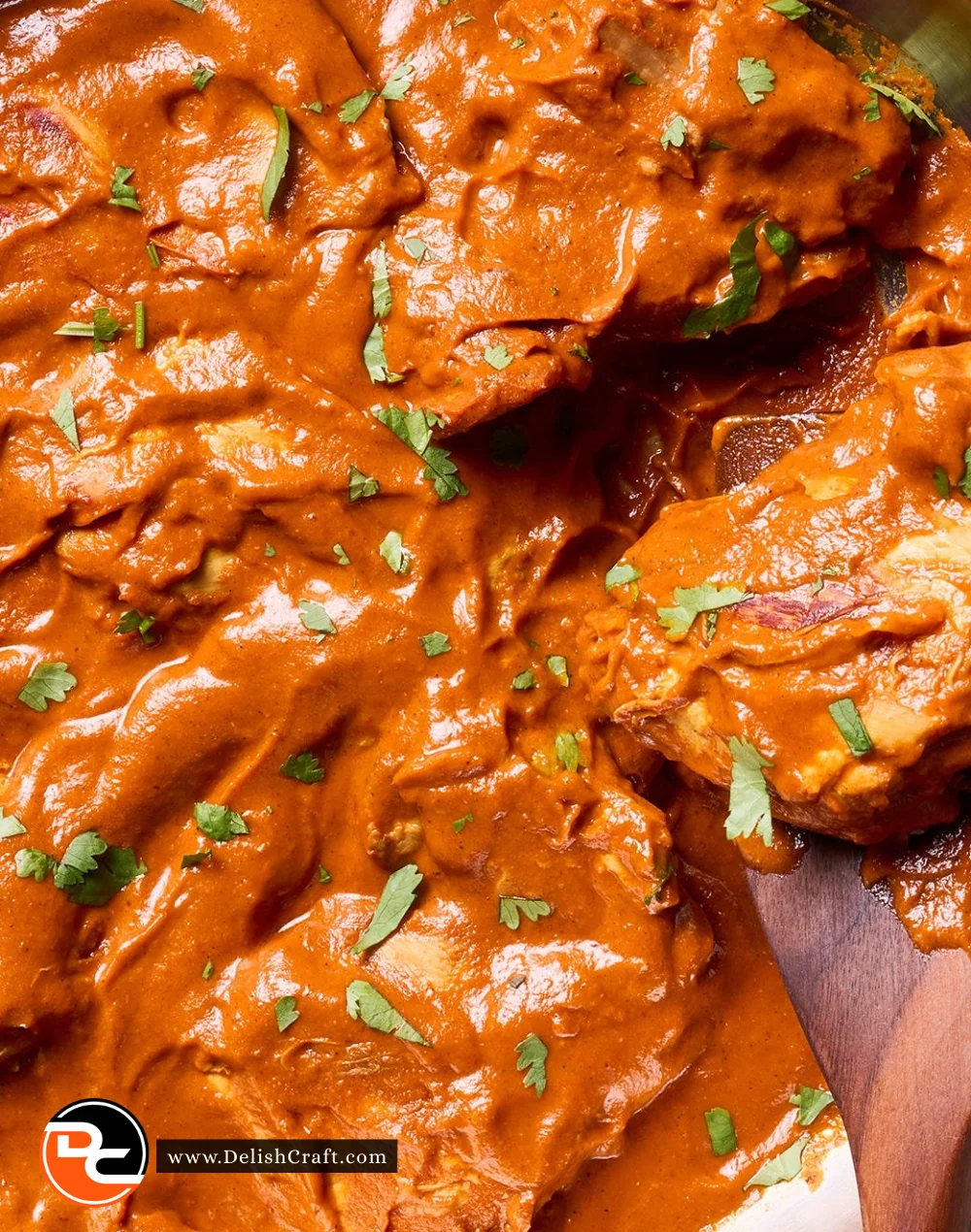 Delicious chicken curry served with rice and garnished with fresh herbs.