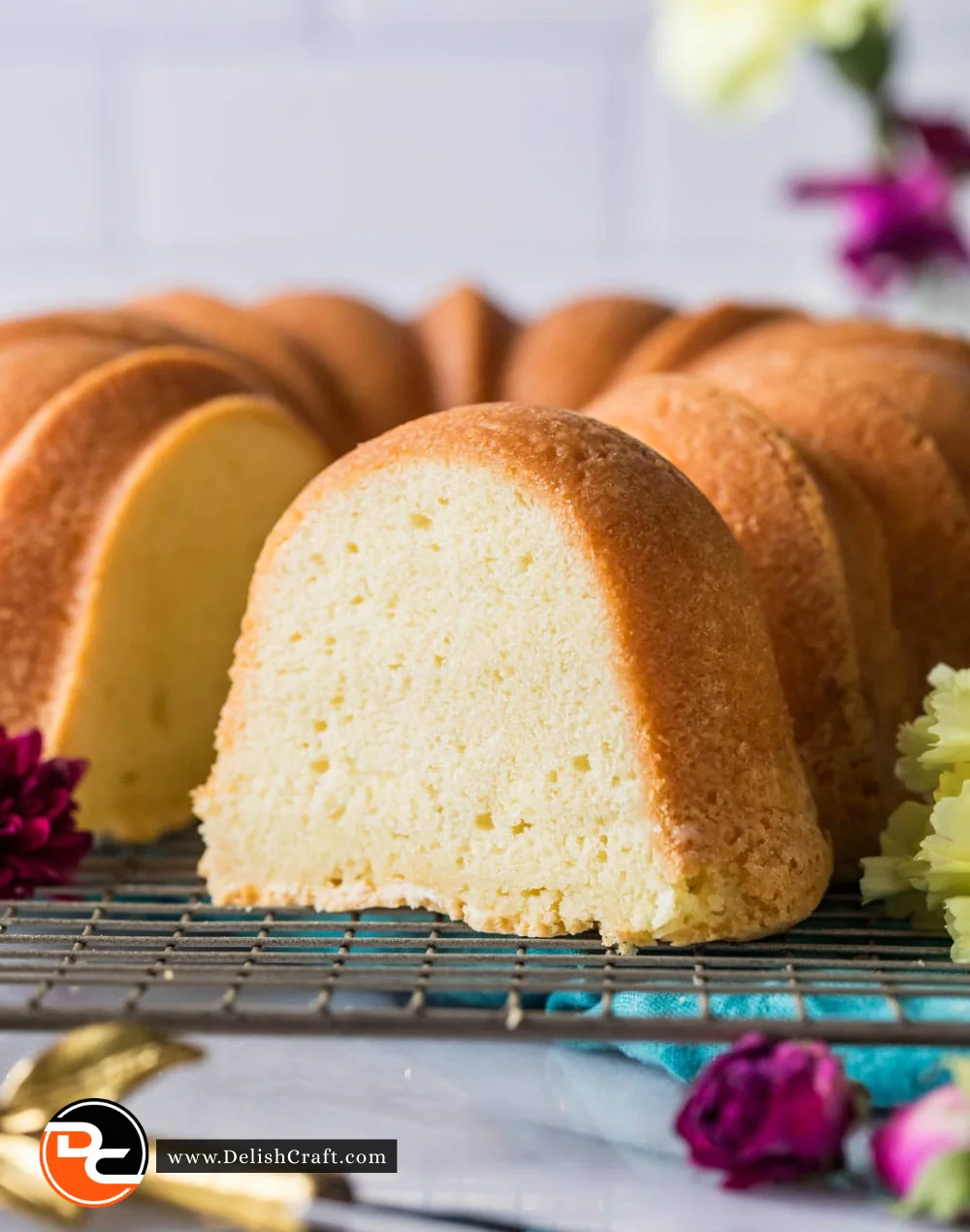 Deliciously moist Cream Cheese Pound Cake served on a plate with a slice cut out