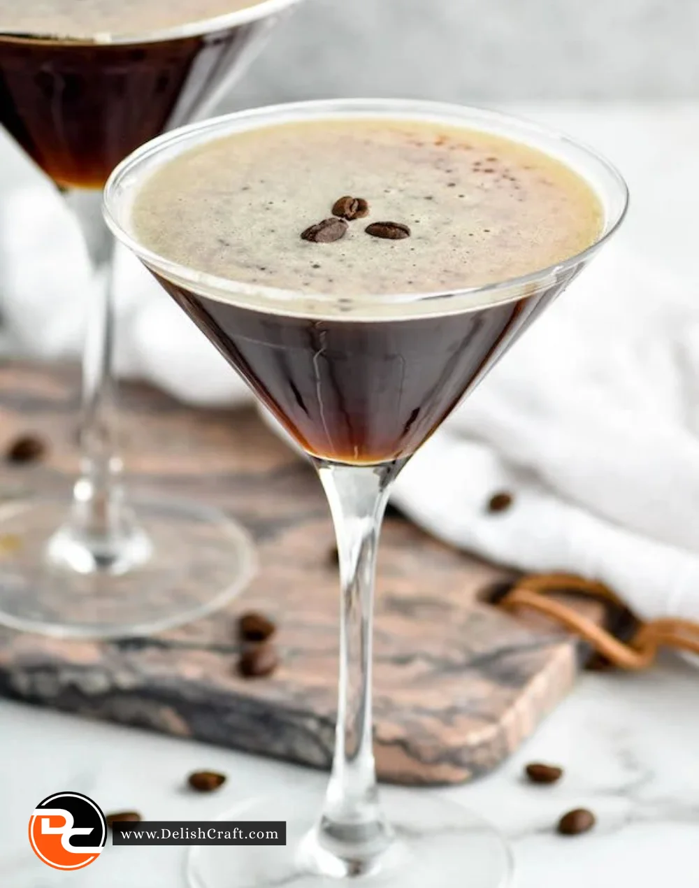 Espresso Martini cocktail garnished with coffee beans in a glass