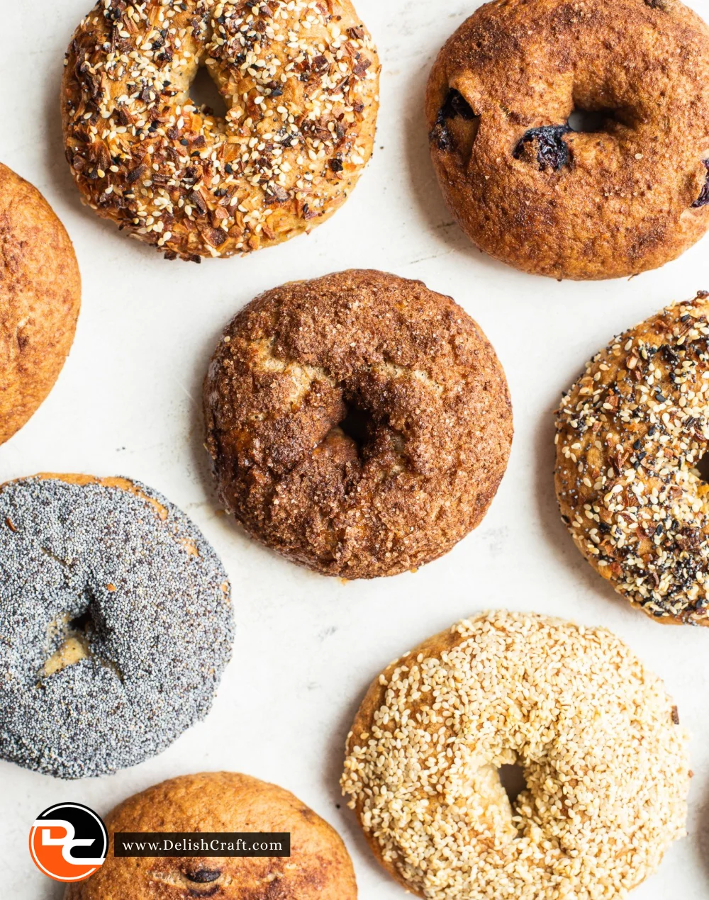 Freshly baked gluten free bagels on a wooden cutting board