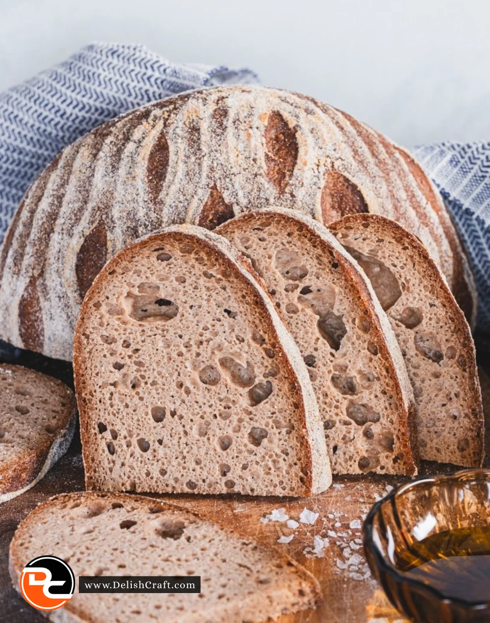 Freshly baked gluten free sourdough bread loaf on a wooden table