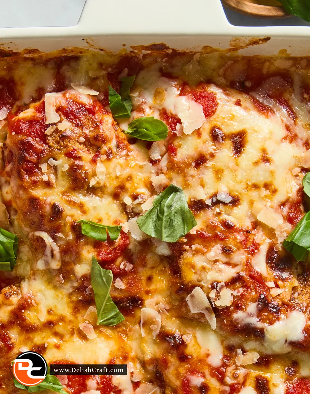 Delicious Keto Chicken Parmesan served with a side salad and cheese