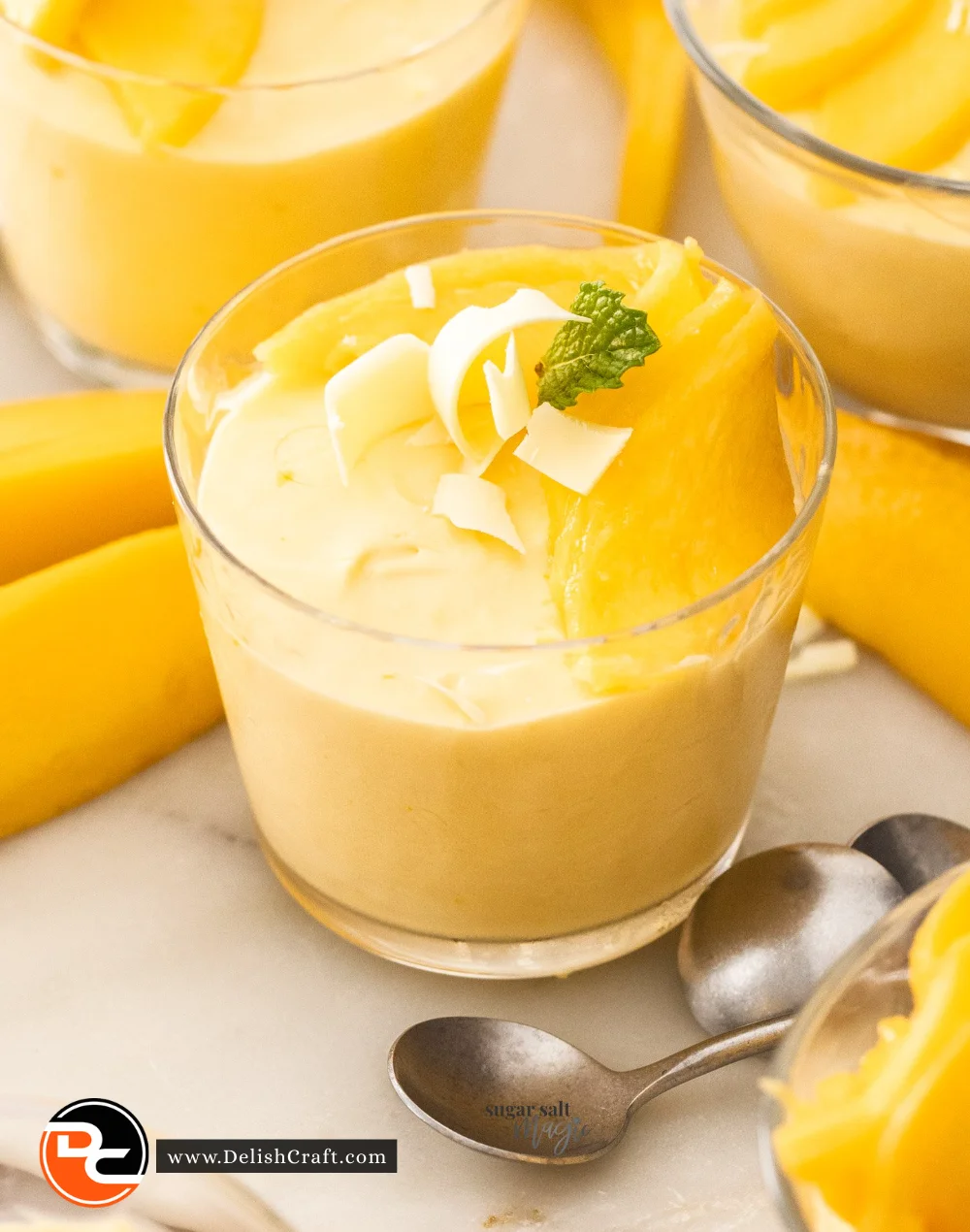 Delicious mango mousse dessert topped with fresh mango slices