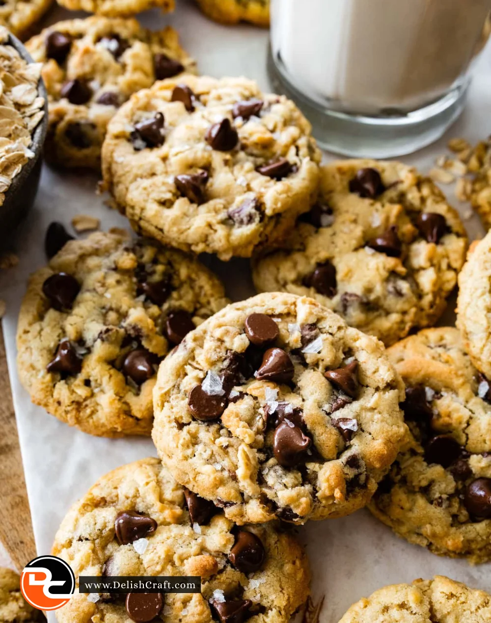 Freshly baked oatmeal chocolate chip cookies on a cooling rack